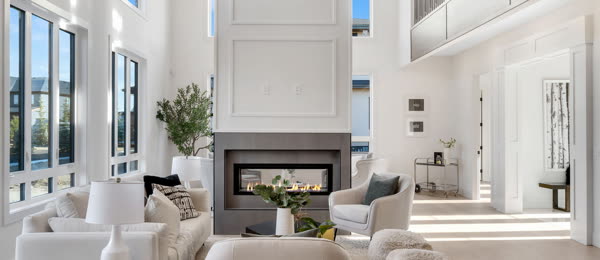 HDR photo of a bright two-storey living room with a modern fireplace